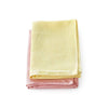 Two Tupperware Eco glass cloths in pale yellow and pink with a waffle weave texture.