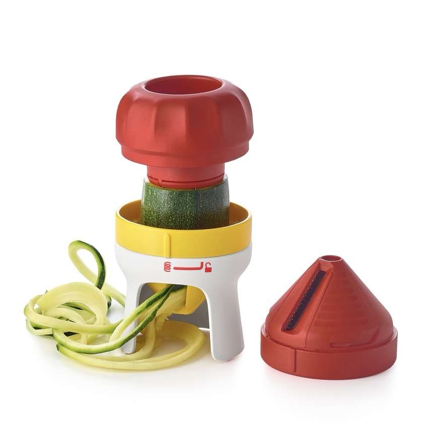 Vegetable spiralizer making zucchini noodles, colorful kitchen tool with detachable blade