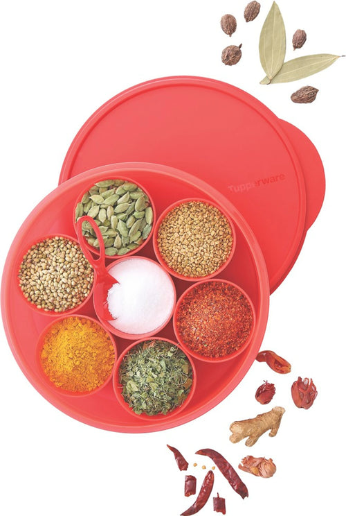 Round red spice box with compartments of assorted spices and a matching red lid