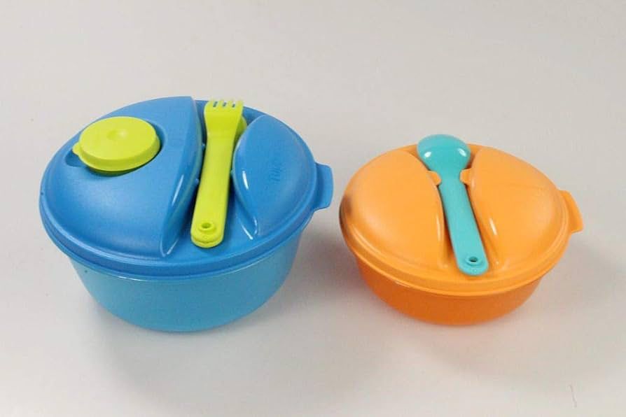 Two colorful plastic lunch boxes with lids, fork and spoon, ideal for meal prep