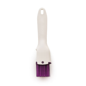 White silicone kitchen brush with purple bristles, ideal for baking or cooking tasks