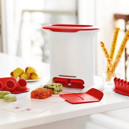 Multi-purpose kitchen tool with red accents on a counter, surrounded by shaped food and baking accessories.
