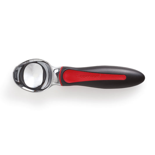 Stainless steel ice cream scoop with black and red ergonomic handle on white background