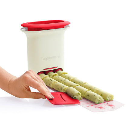 Herb butter roll maker kitchen tool with butter logs being shaped on a silicone tray