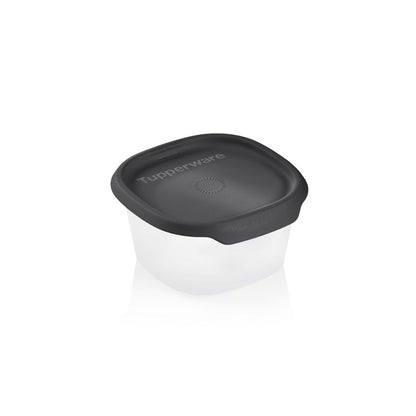 Plastic food storage container with black lid on white background