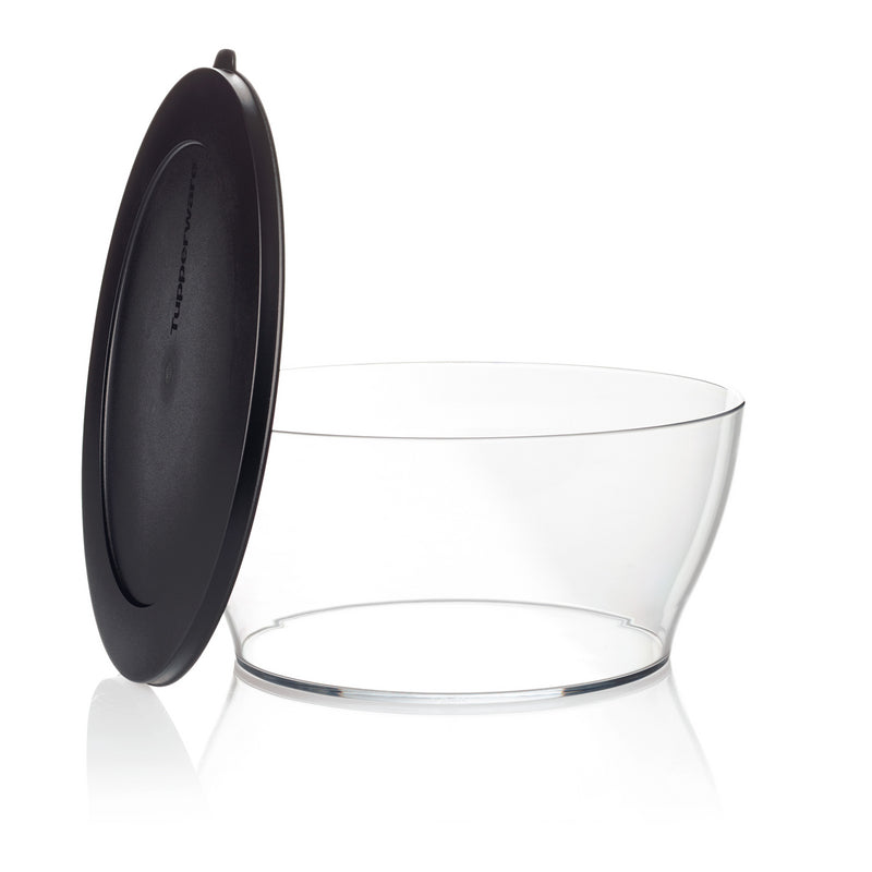 Clear plastic kitchen storage bowl with black airtight lid, isolated on white background