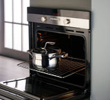 Tupperware Mastro Cookware 3.2L stainless steel pot inside a modern black oven