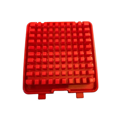 Red silicone kitchen mat with raised square bumps, non-slip heat-resistant surface.