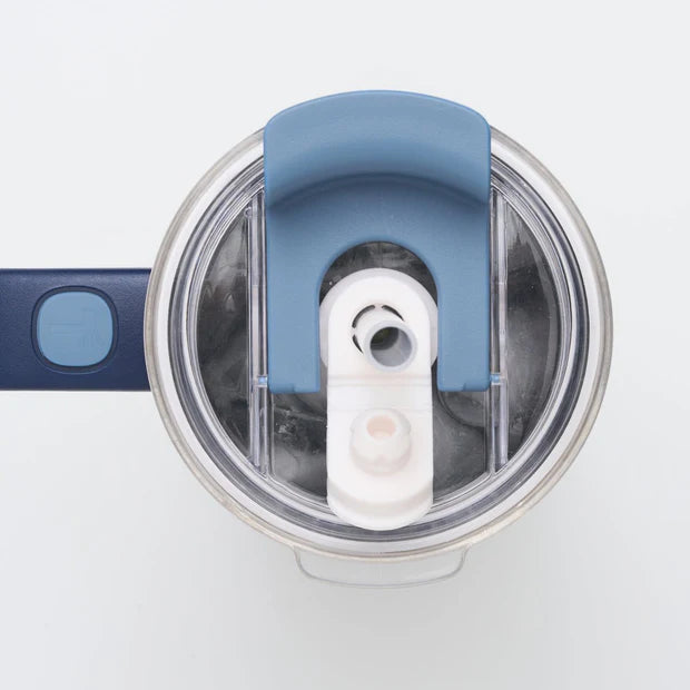 Top view of blue handled tumbler with secure flip lid and drinking spout