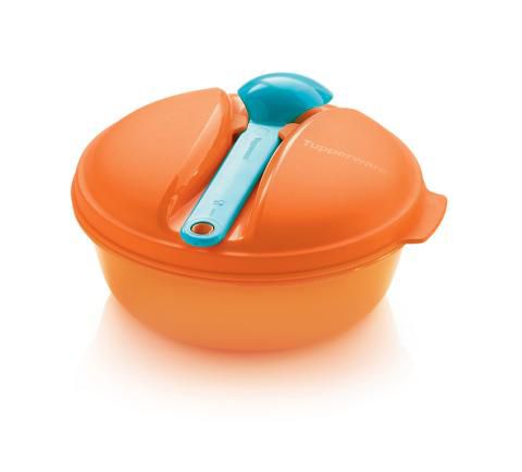 Orange microwave-safe mixing bowl with lid and a blue plastic serving spoon