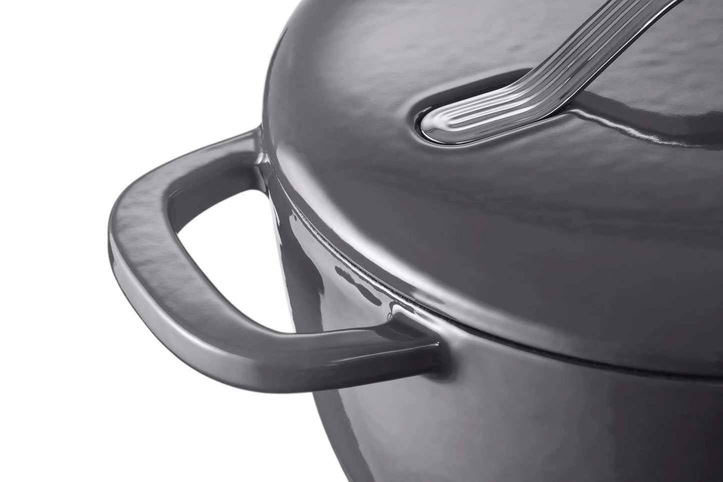 Close-up of a black cast iron Dutch oven with lid and handle, ideal for slow cooking