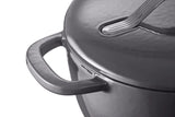 Close-up of a black cast iron Dutch oven with lid and handle, ideal for slow cooking