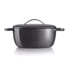Black cast iron Dutch oven with lid and handles on white background