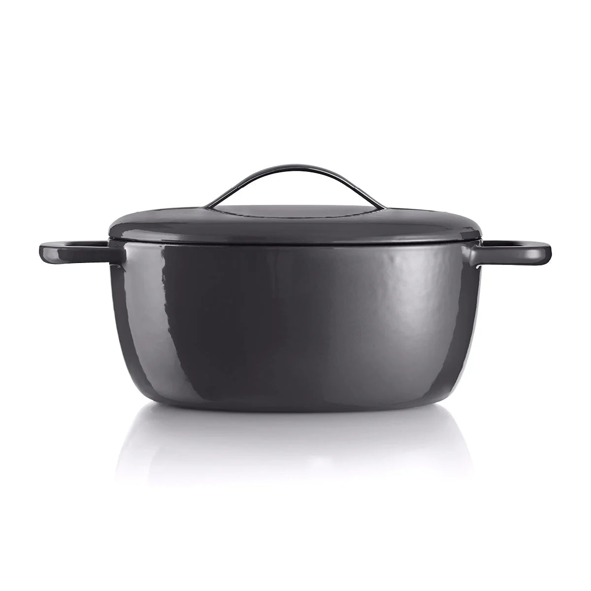 Black cast iron Dutch oven with lid and handles on white background
