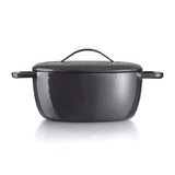Black cast iron Dutch oven with lid and handles on white background