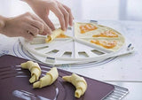 Hands using a Tupperware Croissant Party tray to shape croissants with jam filling.