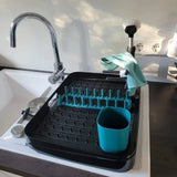 Black Tupperware Dish Caddy drying rack with teal accessories next to a kitchen sink