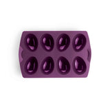 Purple silicone egg mold tray with eight oval cavities for baking or chocolate making