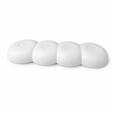 White ceramic kitchen tool rest with four sections, modern minimalist design.