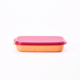 Tupperware Bento Lunch Box with an orange base and a pink lid against a white background.