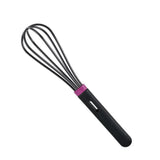 Black silicone kitchen whisk with purple accent, isolated on white background