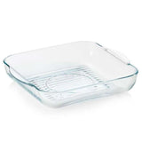 Square glass baking dish with handles and ribbed base, ideal for oven cooking and roasting