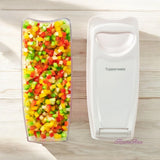 Tupperware Super Dicer with finely diced red, yellow, and green bell peppers.