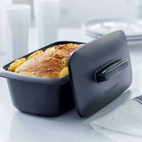 Tupperware UltraPro Terrine containing a golden-brown baked dish with its lid partially open.