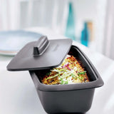 Tupperware UltraPro Terrine 1.8L with lid, containing a baked dish topped with fresh greens.