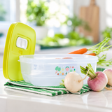 Tupperware VentSmart 800 ml food storage container with green lid and fresh radishes.