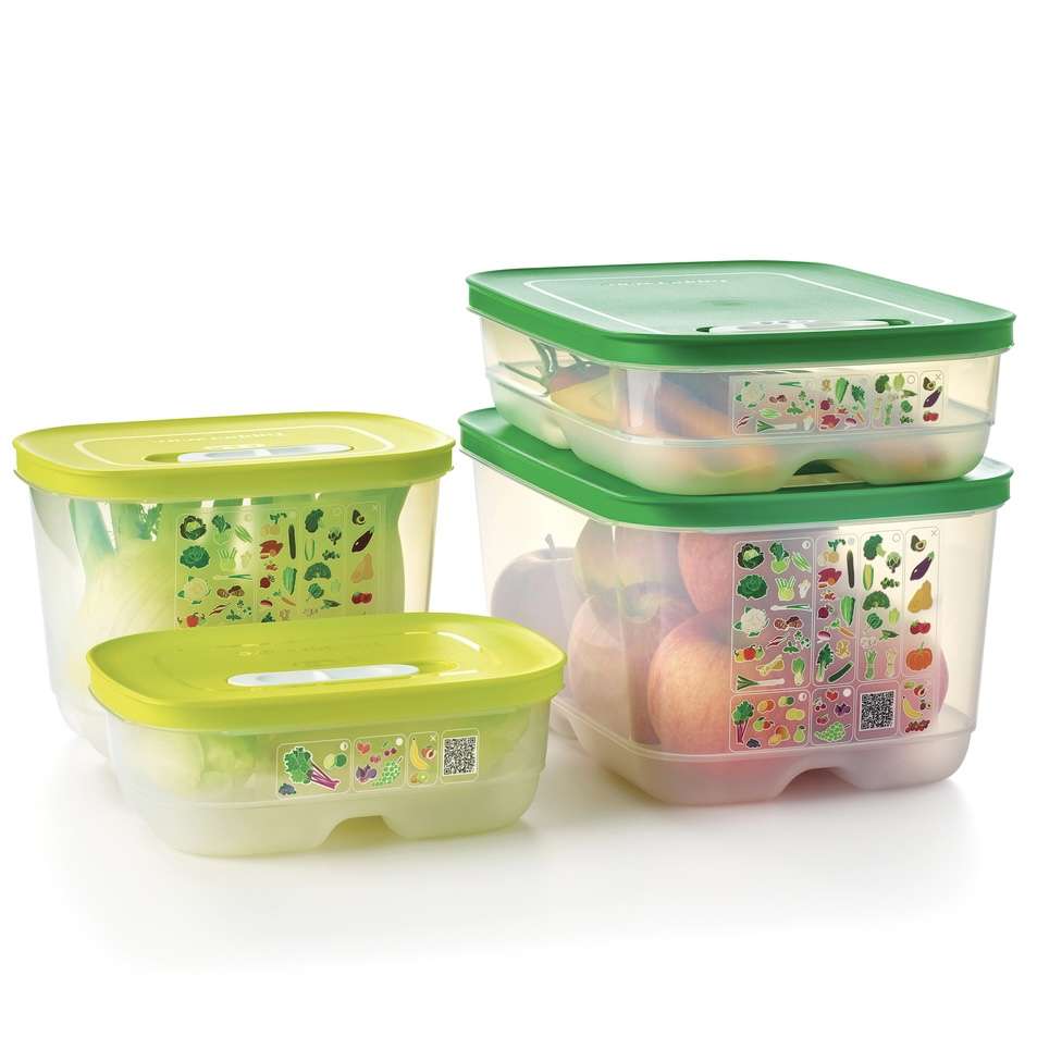 Set of transparent fridge storage containers with green lids for fruits and vegetables