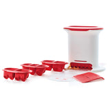 Multi-part kitchen tool set with red and white plastic molds and accessories on white background